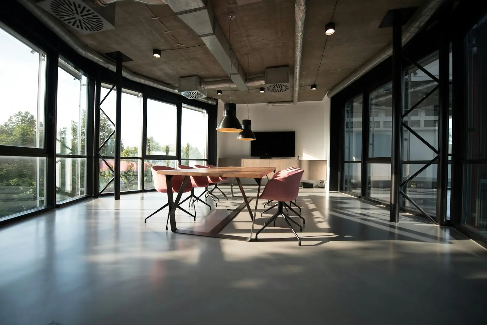 Executive meeting room with floor-to-ceiling windows and city views