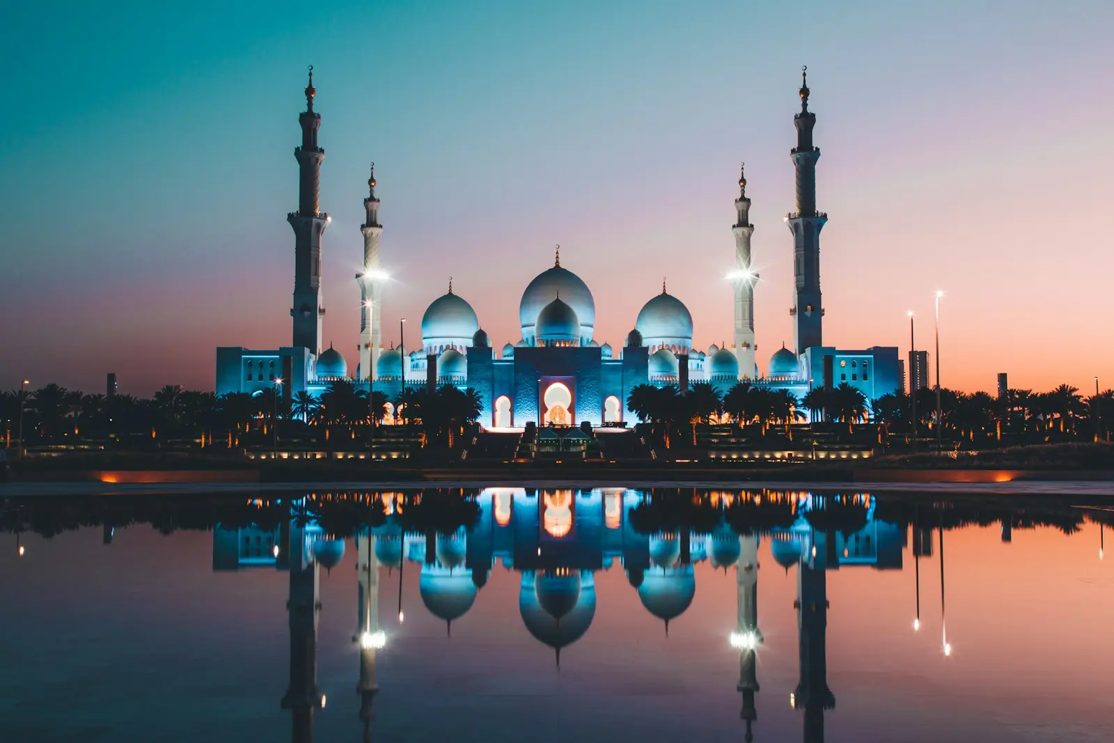 Sheikh Zayed Grand Mosque in Abu Dhabi reflected at dusk